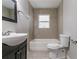 Clean bathroom with a bathtub, toilet and vanity at 2229 Whites Mill Rd, Decatur, GA 30032