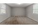 Bright bedroom featuring neutral walls and carpeted floors at 2229 Whites Mill Rd, Decatur, GA 30032