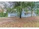 Side view of the house showcasing the backyard at 2229 Whites Mill Rd, Decatur, GA 30032
