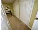 Basement hallway with multiple closets and neutral walls at 2514 Green Forest Ct, Snellville, GA 30078