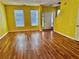 Bright living room with hardwood floors and yellow walls at 4842 Hairston Park Sq, Stone Mountain, GA 30083