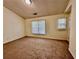 Bright bedroom with window and neutral carpet at 4842 Hairston Park Sq, Stone Mountain, GA 30083