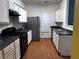 Galley kitchen with white cabinets and dark countertops at 4842 Hairston Park Sq, Stone Mountain, GA 30083