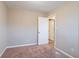 Simple bedroom with carpet floors and access to bathroom at 1496 E Highpoint Dr, Douglasville, GA 30134