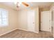 Well-lit bedroom with window, closet and access to hallway at 1496 E Highpoint Dr, Douglasville, GA 30134
