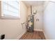 Laundry area with water heater and shelving for storage at 1496 E Highpoint Dr, Douglasville, GA 30134