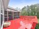 Spacious red deck with screen porch access and wooded views at 20 Madison Ct, Covington, GA 30016