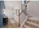 Modern staircase with iron balusters and neutral carpeting at 16 Camellia Dr, Fairburn, GA 30213