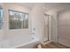 Relaxing bathroom featuring a soaking tub and separate shower at 16 Camellia Dr, Fairburn, GA 30213