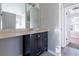 Bathroom vanity with dark wood cabinets and light countertops at 2931 Two Lake Cir, Atlanta, GA 30349