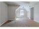 Empty bedroom with slanted ceiling and carpet at 2931 Two Lake Cir, Atlanta, GA 30349