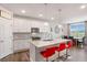 Modern kitchen with white cabinets, granite countertops, and stainless steel appliances at 112 Leveret Rd, Locust Grove, GA 30248