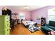 Spacious bedroom with hardwood floors and built-in shelving at 1028 Ridge Ave, Stone Mountain, GA 30083