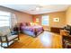 Comfortable bedroom with hardwood floors and a rocking chair at 1028 Ridge Ave, Stone Mountain, GA 30083