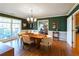 Bright dining room with hardwood floors and green walls at 1028 Ridge Ave, Stone Mountain, GA 30083