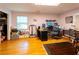 Bright home office features built-in shelving, hardwood floors, and ample space for work and storage at 1028 Ridge Ave, Stone Mountain, GA 30083