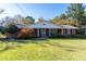 Brick ranch house with front porch and lawn at 1028 Ridge Ave, Stone Mountain, GA 30083