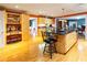 Open kitchen with an island, hardwood floors, and ample cabinet space at 1028 Ridge Ave, Stone Mountain, GA 30083