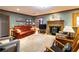 Cozy living room with hardwood floors, built-in bookshelves, and a fireplace at 1028 Ridge Ave, Stone Mountain, GA 30083