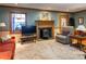 Relaxing living room with hardwood floors, a fireplace, and comfortable seating at 1028 Ridge Ave, Stone Mountain, GA 30083