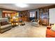 Spacious living room with hardwood floors, a fireplace, and built-in shelving at 1028 Ridge Ave, Stone Mountain, GA 30083