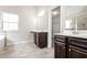 Double vanity bathroom with soaking tub and shower at 7843 Shertall St, Fairburn, GA 30213