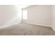 Well-lit bedroom with carpet and neutral walls at 7843 Shertall St, Fairburn, GA 30213