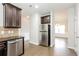 Kitchen with stainless steel appliances and granite countertops at 7843 Shertall St, Fairburn, GA 30213