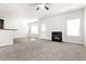 Spacious living room with fireplace and hardwood floors at 7843 Shertall St, Fairburn, GA 30213