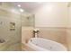 Bathroom with a large soaking tub and a separate walk-in shower at 78 Paces West Nw Cir, Atlanta, GA 30327