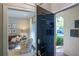 Stylish entryway with dark blue door opening to living room at 78 Paces West Nw Cir, Atlanta, GA 30327