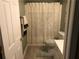 Clean bathroom with a shower/tub combo and light wood floor at 514 Martin Forest Ln, Lawrenceville, GA 30045