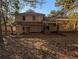 Rear view of house showcasing a patio and surrounding yard at 3142 Pheasant Dr, Decatur, GA 30034