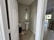Simple bathroom with pedestal sink, toilet, and tiled floor. Ready for final touches at 6415 Grey Fox Way, Riverdale, GA 30296
