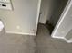 Laundry area with tiled floor, showing some signs of water damage and ongoing repairs at 6415 Grey Fox Way, Riverdale, GA 30296