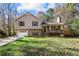 House exterior featuring a tan two-story house with a garage and deck at 1012 Davis Mill S Rd, Dallas, GA 30157