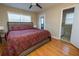 Main bedroom with hardwood floors and ensuite bathroom at 2418 Henderson Rd, Tucker, GA 30084