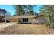 Brick ranch house with attached carport and spacious yard at 2418 Henderson Rd, Tucker, GA 30084