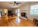 Living room with hardwood floors, fireplace and built-in shelving at 2418 Henderson Rd, Tucker, GA 30084