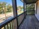 Spacious balcony with wooden deck and railing overlooking the street at 1812 Lakewood Se Ave, Atlanta, GA 30315