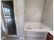 Bathroom with corner tub and separate shower at 1812 Lakewood Se Ave, Atlanta, GA 30315