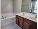 Primary bathroom with a garden tub and double vanity at 1812 Lakewood Se Ave, Atlanta, GA 30315