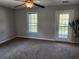 Bedroom with private balcony access and ceiling fan at 1812 Lakewood Se Ave, Atlanta, GA 30315
