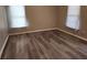 Bright bedroom with gray vinyl flooring and neutral wall colors at 1812 Lakewood Se Ave, Atlanta, GA 30315