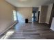 Spacious dining area with gray vinyl flooring and large windows at 1812 Lakewood Se Ave, Atlanta, GA 30315
