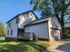 House exterior showcasing a detached garage and wooden deck at 1812 Lakewood Se Ave, Atlanta, GA 30315