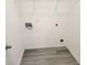 Laundry area with vinyl flooring and hookups for washer and dryer at 1812 Lakewood Se Ave, Atlanta, GA 30315