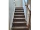 Staircase with carpeted steps and wood railings at 1812 Lakewood Se Ave, Atlanta, GA 30315