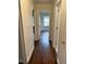 Hallway with dark hardwood floors and access to bedrooms at 2962 Mcafee Rd, Decatur, GA 30032