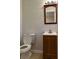 Clean bathroom with vanity, toilet, and mirror at 2962 Mcafee Rd, Decatur, GA 30032